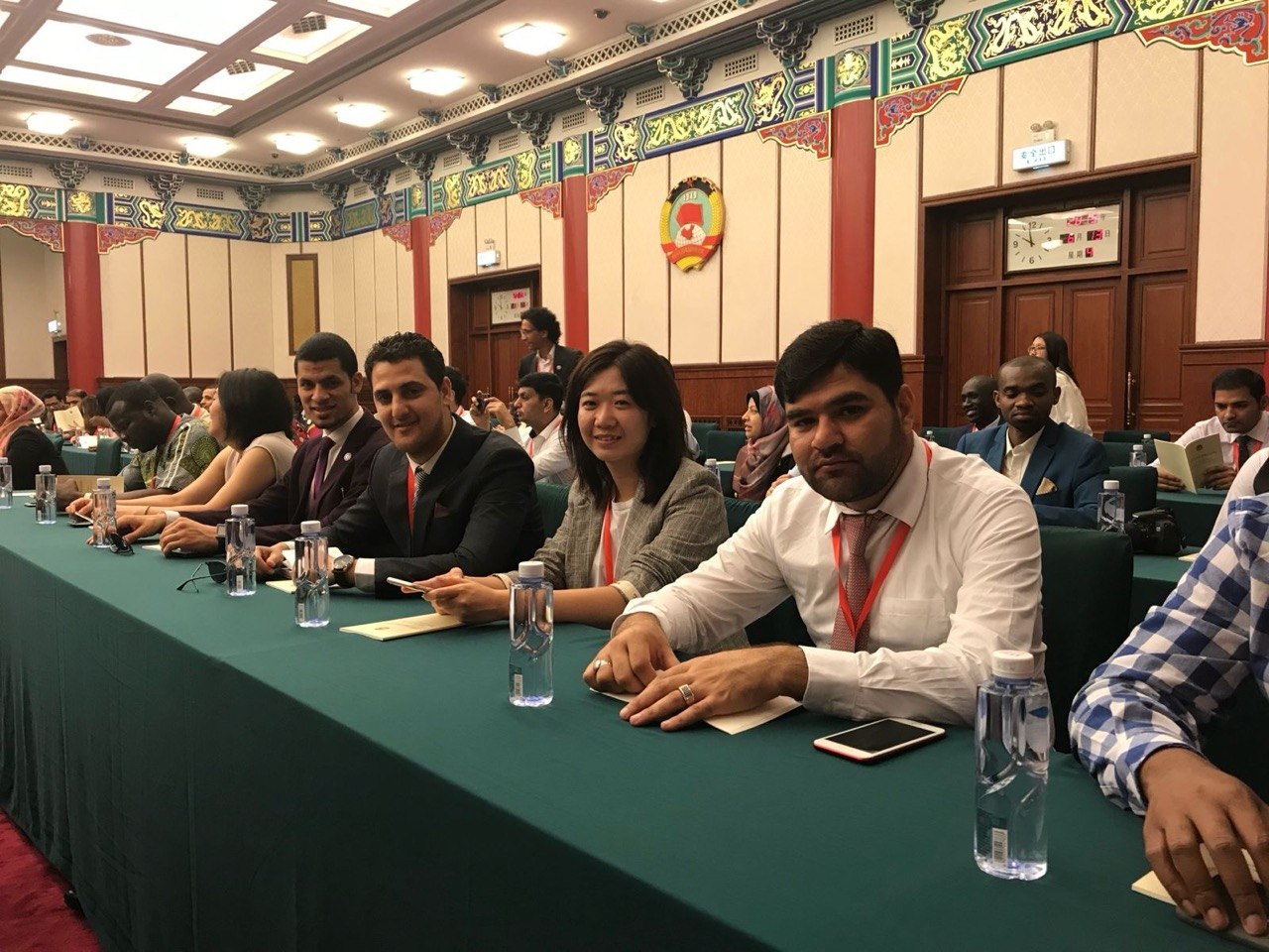 Seated at an international conference in Beijing
